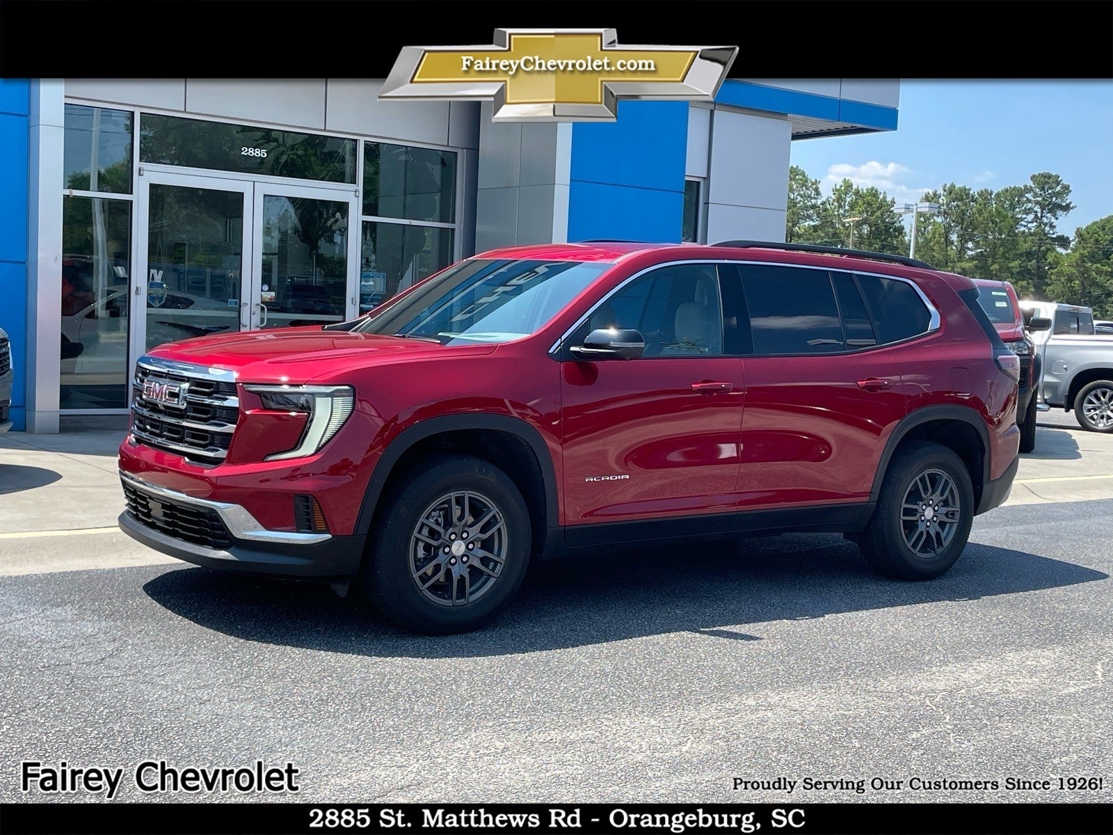 2025 GMC Acadia Elevation in Volcanic Red Tintcoat — front three-quarter view
