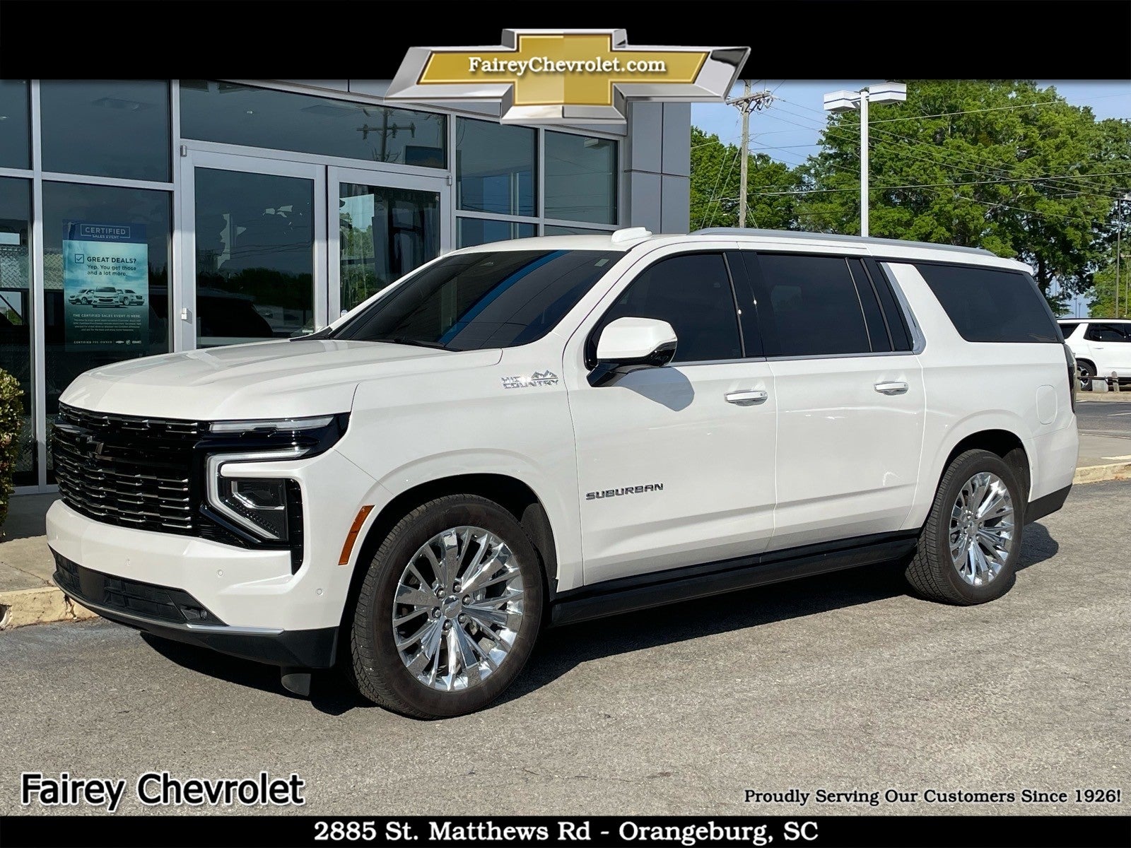 2025 Chevrolet Suburban High Country in Iridescent Pearl Tricoat — front three-quarter view