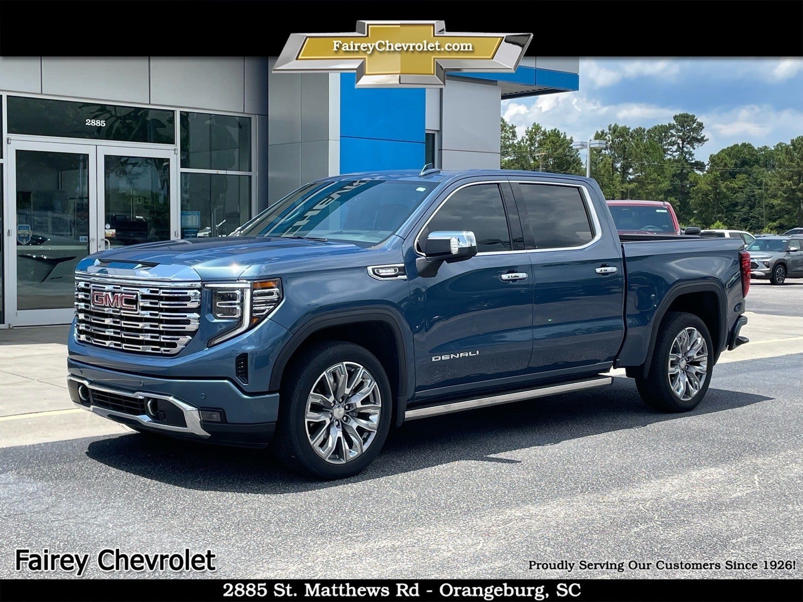 2024 GMC Sierra 1500 Denali in Downpour Metallic — front three-quarter view
