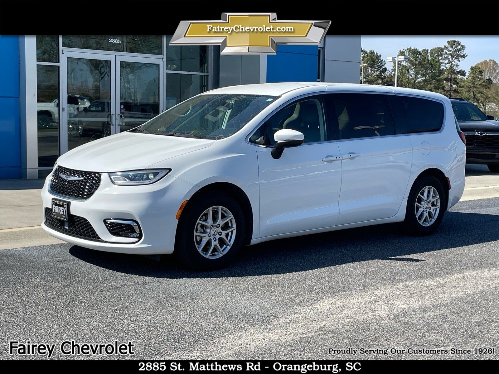 2023 Chrysler Pacifica Touring L in White — front three-quarter view